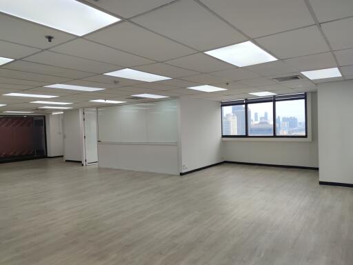 Spacious empty office with large windows