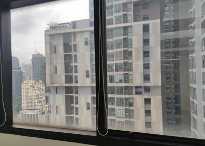 View from window with cityscape and high-rise buildings