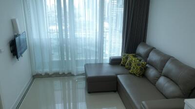 Modern living room with large glass doors and natural light