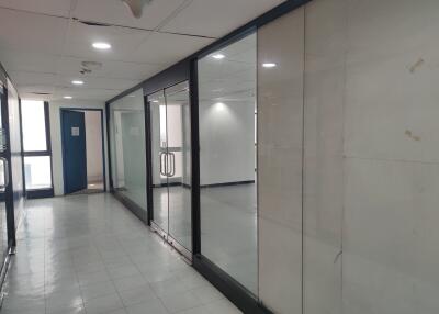 Hallway with glass panels and doors