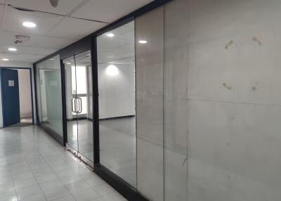 Hallway with glass partitions