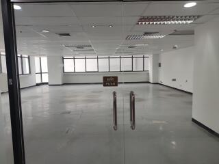 Empty office space with glass door