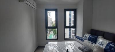 bedroom with multiple windows and air conditioning