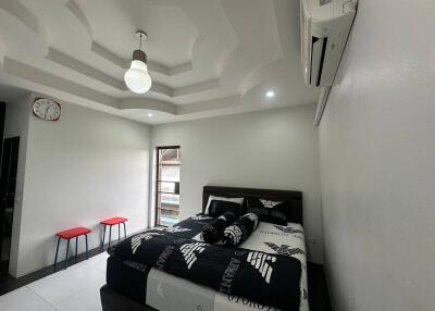 Modern bedroom with unique ceiling design