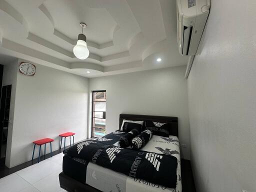 Modern bedroom with unique ceiling design