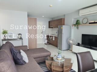 Modern living space with kitchen and dining area in Surawong City Resort