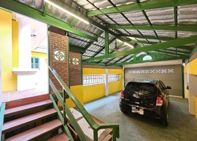 Spacious garage with a parked car and industrial aesthetics