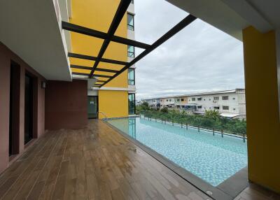Outdoor pool with wooden deck