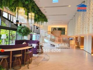 Stylish modern lobby with seating area and greenery