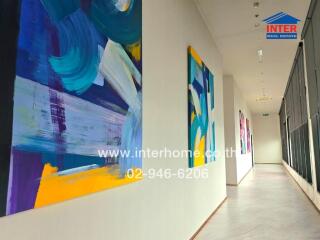 bright hallway with abstract paintings