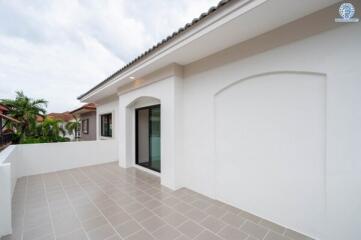 Modern terrace with tiled floor and glass door