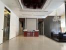 Lobby with a reception desk, seating area, and chandelier