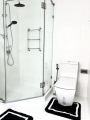 Modern bathroom with glass shower and toilet