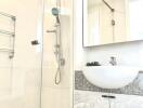 Modern bathroom with glass shower and sink