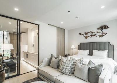 Modern bedroom with glass partition and stylish decor