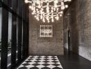 Modern building lobby with unique chandelier and checkered floor