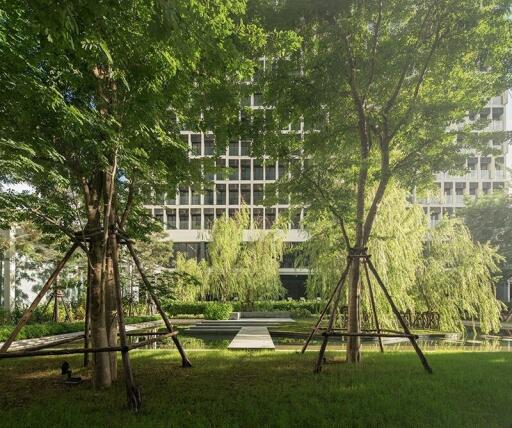 View of modern building with garden and walkway