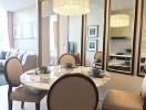 Stylish dining area with reflective mirrors and elegant chandelier