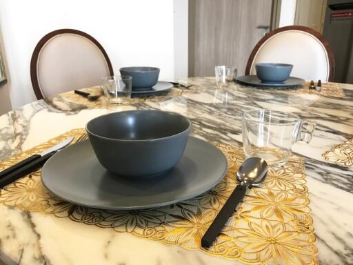 Dining area with a marble table set for three