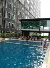 Modern high-rise building with outdoor swimming pool