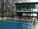 Modern high-rise building with outdoor swimming pool