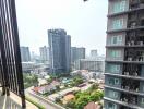 View of buildings and cityscape from a high-rise balcony