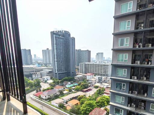 View of buildings and cityscape from a high-rise balcony