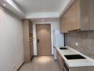 Modern kitchen with wood cabinetry and tile flooring