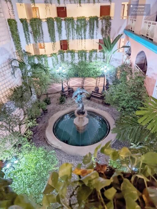 Courtyard with fountain and greenery