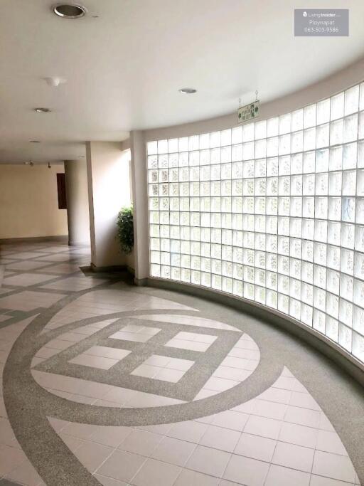 Curved glass block wall in hallway