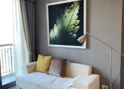 Living room with balcony, sofa, and modern decor