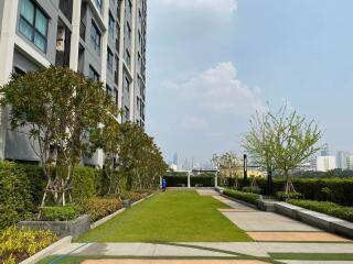 Outdoor area with landscaped garden and building