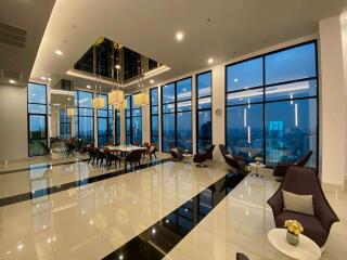 Spacious modern common area with large windows and city views