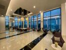 Spacious modern common area with large windows and city views