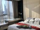 Modern bedroom with large window and city view