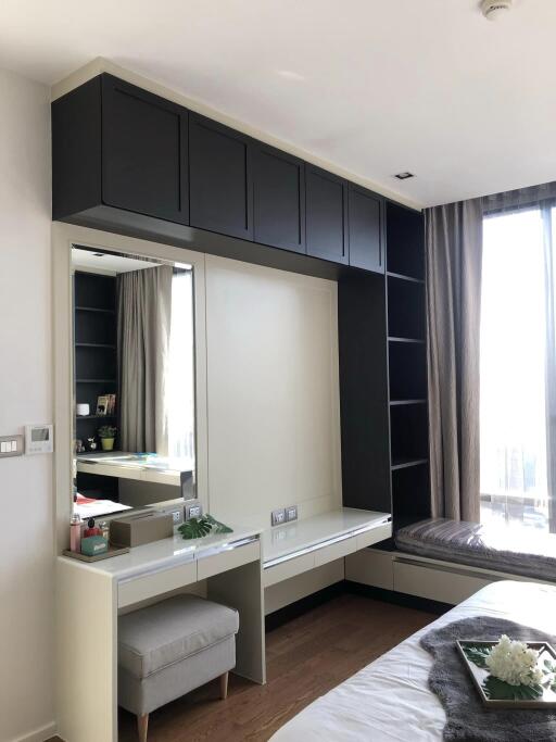 Modern bedroom with built-in shelves and dressing table