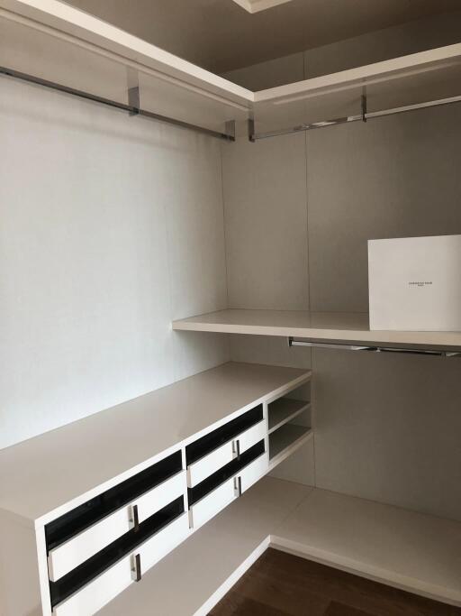 Walk-in Closet with Shelves and Hanging Rods