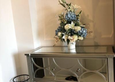 decorative console table with floral arrangement