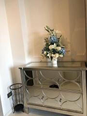 decorative console table with floral arrangement