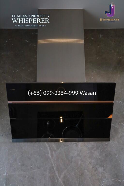 Stainless steel kitchen hood with black glass control panel