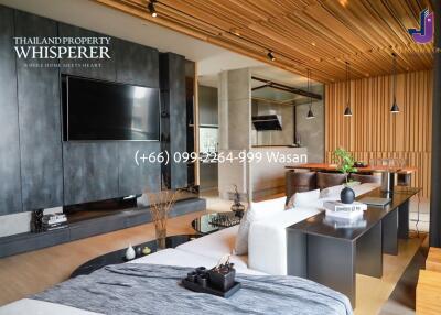 Modern living area with wooden ceiling and contemporary furnishings