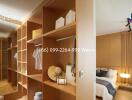 Spacious bedroom with wooden wardrobes and neatly arranged furniture