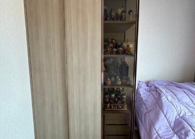 Bedroom with wooden wardrobe and display cabinet