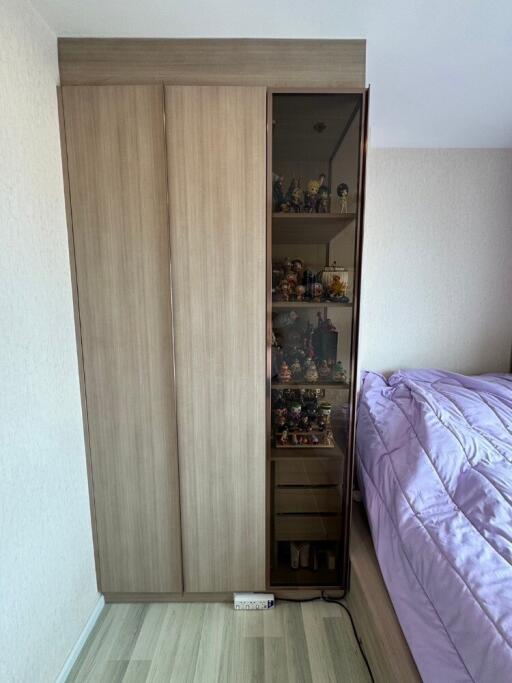 Bedroom with wooden wardrobe and display cabinet