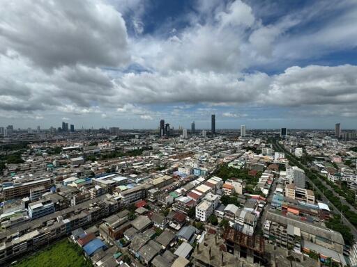 Aerial view of a city with cloudy sky