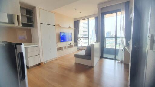 Modern living room with built-in furniture and city view