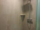 Modern shower area with wall tiles and rain showerhead