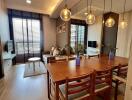 Modern living and dining area with wooden furniture and decorative lighting