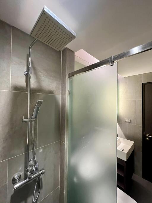 Modern bathroom with frosted glass shower and sink