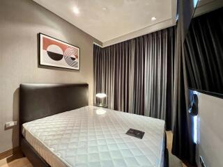 Modern bedroom with artwork and curtains